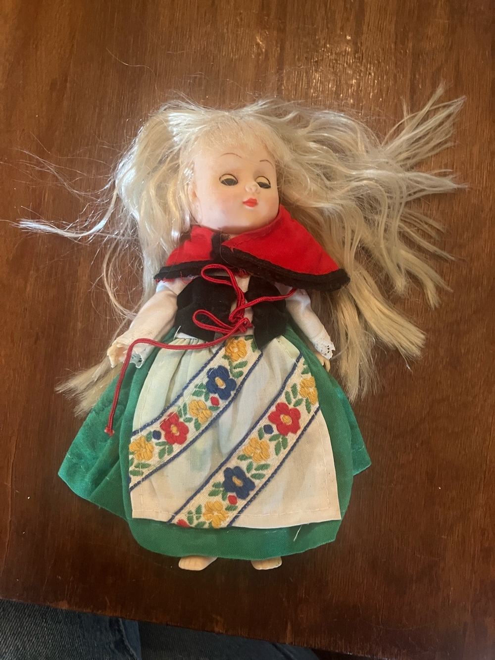 Blonde Doll in Green Skirt with Red Cape and Floral Apron